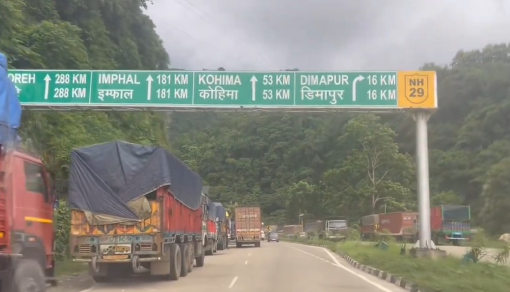 In this photo taken August 21, numbers of trucks are seen stranded on National Highway-29 Dimapur Bypass near Chathe River Bridge, Chümoukidima due to massive landslide near Dzüdza Bridge. (morung File Photo)